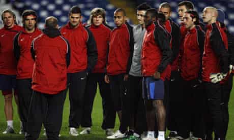 CFR Cluj manager Maurizio Trombetta speaks to his players during training at Stamford Bridge