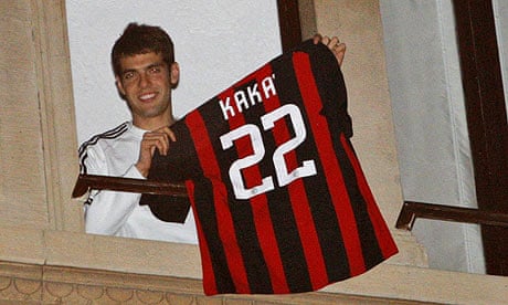 AC Milan's Kaka shows his jersey from the window of his house in Milan