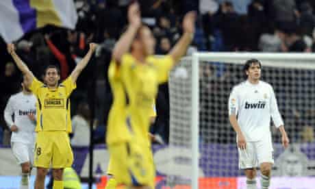 Alcorcón players celebrate at the final whistle as Real Madrid's Kaká looks dejected