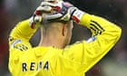 Liverpool goalkeeper Jose Reina stands dejected