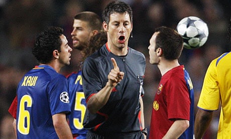 Barcelona's Xavi and Andres Iniesta complain to referee Wolfgang Stark.
