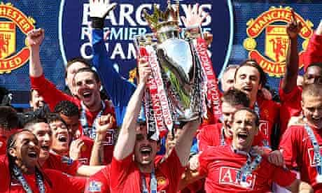 Manchester United's Gary Neville lifts the Premier League trophy