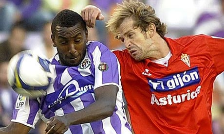 Real Valladolid's Senegalese forward Henok Goitom  vies for the ball with Sporting's Gerard Aute