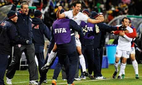 Landon Donovan and Benny Feilhaber celebrate with team-mates after Clint Dempsey's goal