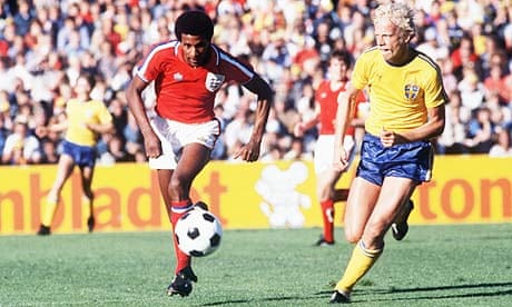 Viv Anderson of England (left) takes on a Swedish defender