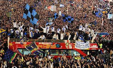Inter players and staff celebrate on a bus in Duomo square, Milan, after their Serie A title win