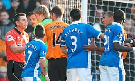 The aftermath of the incident in which Wigan's Antolin Alcaraz spat at a Wolves player