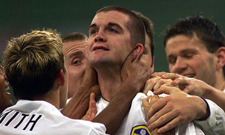 Dominic Matteo is congratulated by his Leeds team-mates after scoring against Milan