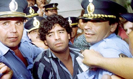 Diego Maradona leaves a courthouse after answering charges he shot and injured journalists