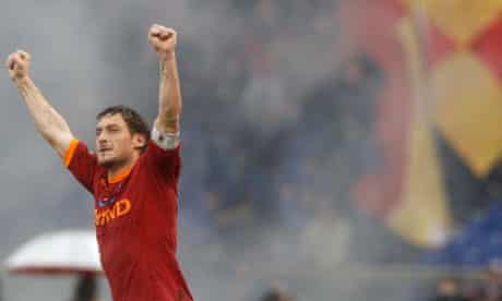 Roma's Francesco Totti celebrates after scoring against Lazio