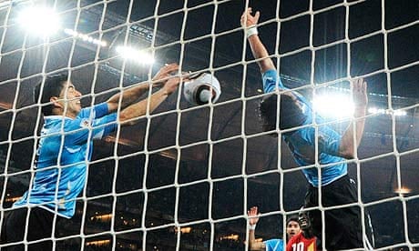 Uruguay's Luis Suárez handles the ball against Ghana
