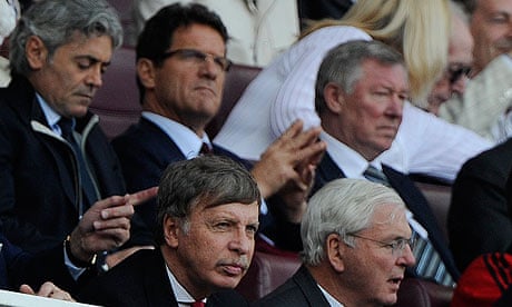 Stan Kroenke, bottom left, in front of Fabio Capello and Sir Alex Ferguson at Arsenal