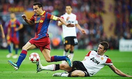 Michael Carrick, the England midfielder, tackling Xavi in the Champions League final