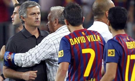 Real Madrid's José Mourinho is restrained 