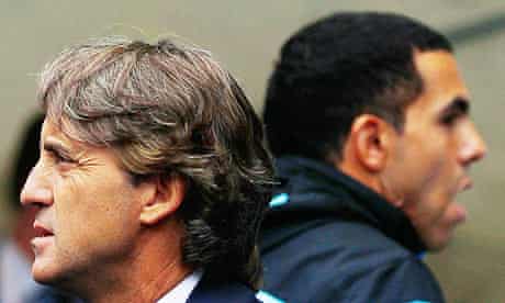 Manchester City's Carlos Tevez with Roberto Mancini