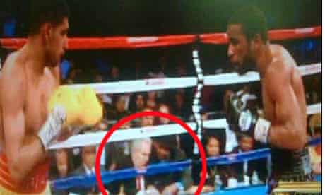 Amir Khan has questioned the presence of a mystery man in a hat at his defeat to Lamont Peteerson.