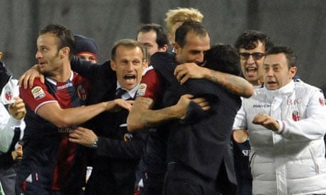 Bologna's players and team staff celebrate after Daniele Portanova scored the winner.