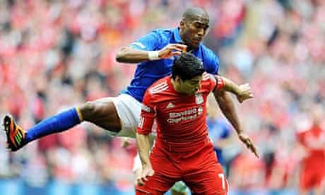 Luis Suárez of Liverpool and Sylvain Distin of Everton compete in the FA Cup semi-final at Wembley