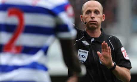 The referee Mike Dean