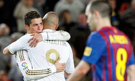 Cristiano Ronaldo is congratulated by Karim Benzema as they celebrate victory over Barcelona