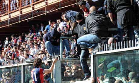 Genoa's Giuseppe Sculli talks to supporters during the match