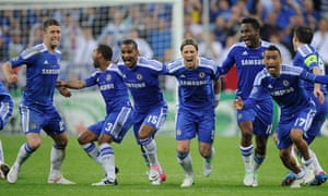 The Chelsea players celebrate as Drogba scores final penalty