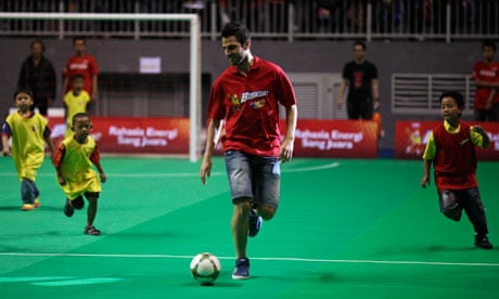 Cesc Fabregas plays futsal with a children's team during a promotional event in Jakarta this week