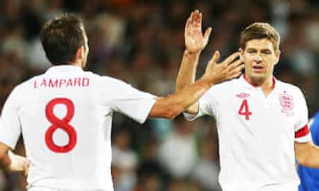 England's Frank Lampard, left, celebrates with Steven Gerrard after scoring against Moldova.