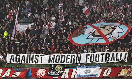 Ajax fans show the banner at the Manchester City game that has led to a €10,000 fine from Uefa