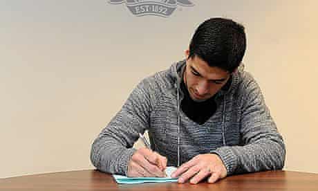 Luis Suarez signs