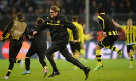 Dortmund coach Jurgen Klopp celebrates with his players after their dramatic Champions League win
