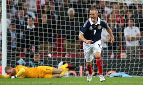 Kenny Miller of Scotland celebrates scoring past England's Joe Hart