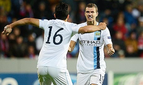 Manchester City's Edin Dzeko, right, celebrates with Sergio Agüero after scoring at Viktoria Plzen
