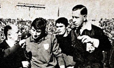 Ken Aston sends off Italy’s Giorgio Ferrini, escorting him from the pitch, after he had retaliated by kicking Chile players.