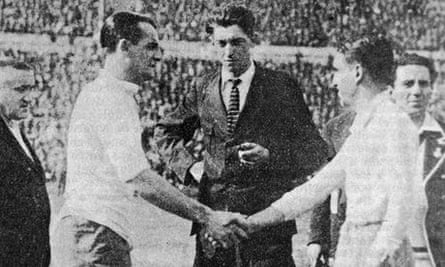 Uruguay’s captain, José Nazassi, left, shakes hands with Argentina’s ‘Nolo’ Fereyra in front of World Cup final referee John Langenus.