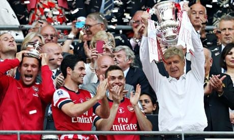 Arsenal manager Arsene Wenger lifts the FA Cup
