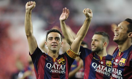 Barcelona midfielder Xavi Hernández celebrates one final trophy following his side's victory in the 