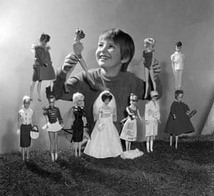 Gallery Barbie: February 1965: A young girl plays with two Barbie dolls