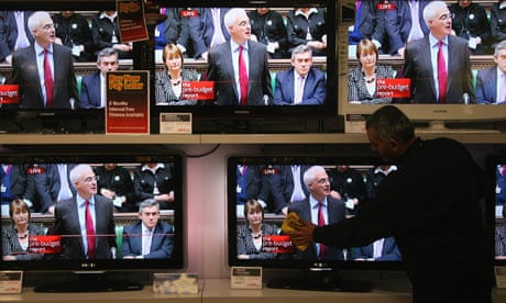Televisions showing Alistair Darling as he delivers his Pre-Budget Report