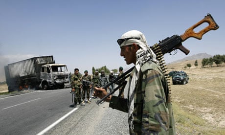 Afghan soldiers at the scene of a Taliban attack on a US supply truck