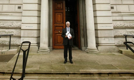Alistair Darling holds a copy of his pre-budget report