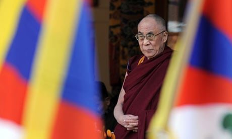 The Dalai Lama offers prayers during a gathering at his palace temple in Dharamshala