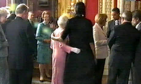 Michelle Obama with her arm around the Queen during a reception at Buckingham Palace