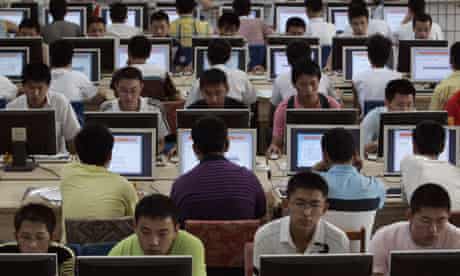 Customers use computers at an internet cafe in Taiyuan, China