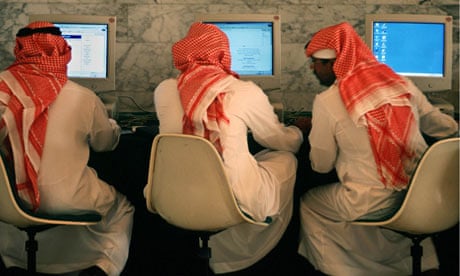 Saudi men talk and browse the internet at a hotel in Riyadh