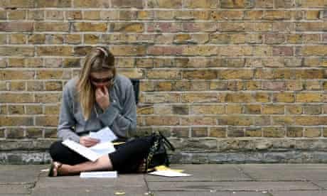 A pupil checks her A-level exam results 