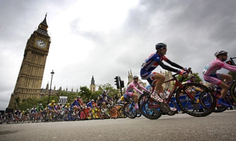 Cyclists ride past Big Ben during the Tour of Britain cycle race
