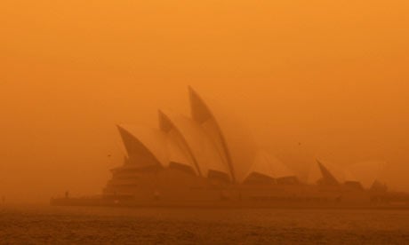 A dust storm blankets Sydney's iconic Opera House at sunrise