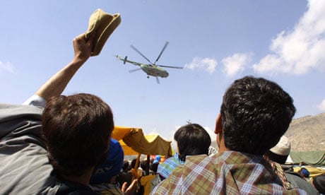A helicopter drops leaflets in Afghanistan