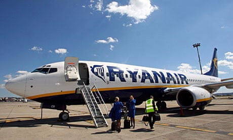 Ryanair crew stand in front of a passenger jet in Marseille